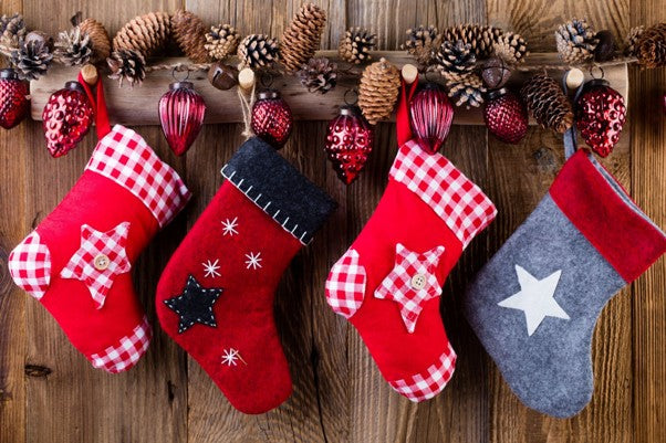 Branded Christmas stockings customised with company logos and festive designs, ideal for corporate gifts for clients and employees.