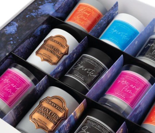 Branded event Merchandise displayed in a selection of customised gift boxes for promotional use.
